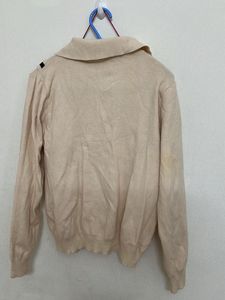 beige long-sleeved top with a sailor