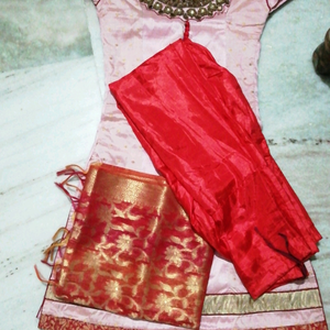It is a patiyala dress along with duppata. one time used. no damage to patiyala Pant or duppata and the top had little that the red colour buttons has a  stitching  damage.
