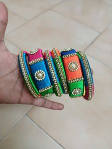 2 Sets Of Multi Colour Thread Bangles