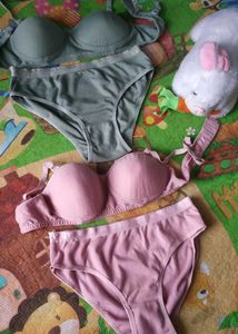 Two matching bra and panty sets