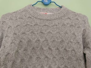 girls woolen sweater of white colour