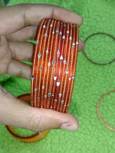 combo of glass and metal bangles