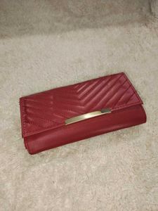 it's new Burgundy Clutch with Gold Detail