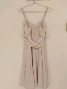 Light Pink Coloured One Piece With Bow Design At Back