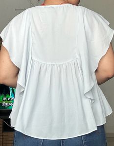 light blue frilled top