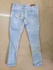 Ripped Light Wash Blue Jeans