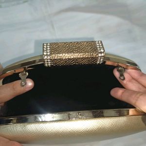 Golden Clutch Bag With Chain Sling Attachment