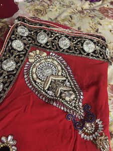 Red saree with embellishments