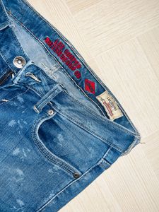 Edgy Elegance Distressed Floral Skinny Jeans”