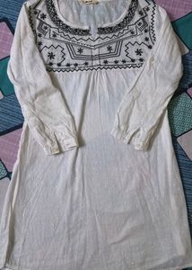 Pure Cotton, White Kurti From The Brand DJ&amp; C.It Has Black Thread Work With Silver Sequins Work.