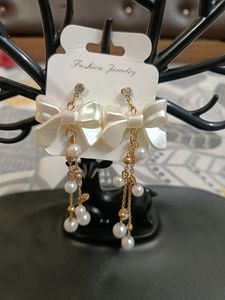 Sheron bow dangling earing