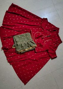vibrant red lehenga with contrast olive green dupt