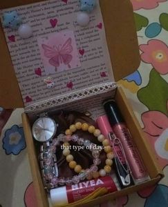 Gift box with jewelry, cosmetics, and lip balm