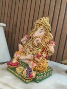 Ganesha Statue with Fruit Offerings