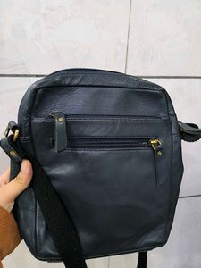 Good condition crossbody blue leather bag.