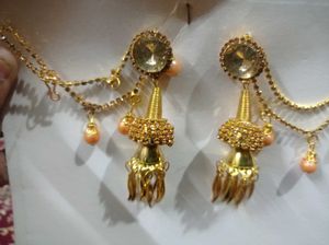 Gold toned Jhumka Earrings with Hair Chain
