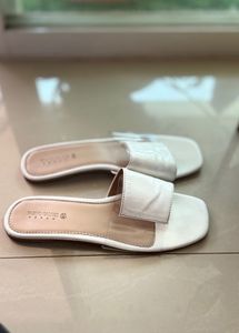 Elegant White Slip-On Sandals by Tokyo Talkies