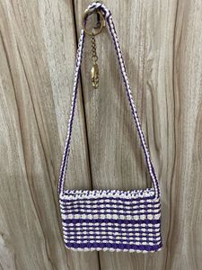A Handmade Macrame Sling Bag.