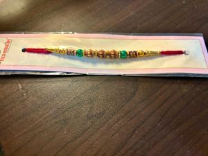 Buy 1 Rakhi Get Kalyan Jewellery 2100 Voucher Free