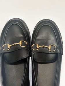 Black Loafers with Gold Detail