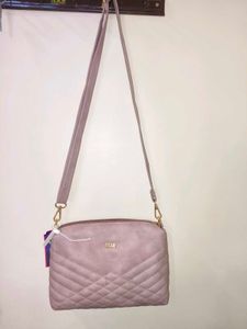 Pink Mochi Sling Bag With Quilted Front And Solid