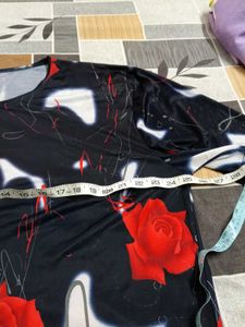 smart black top with red flowers on it