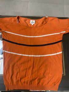 again orange broad neck top