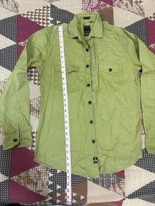 Combo of green shirt and denim jeans