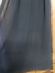 Black slip dress, ankle length.