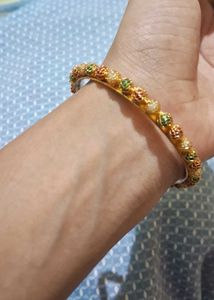 Elegant Gold Bangle with Colorful Bead Accents