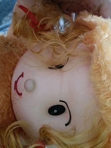 Doll With Brown Hat And Dress