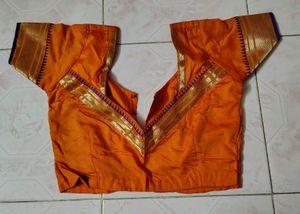 Mustard color saree with purple border and blouse