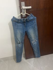 Ripped Knee Denim Jeans