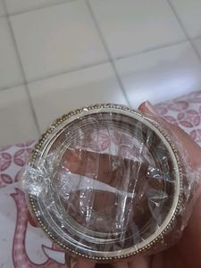 Stone Bangles Of White And Golden Color.