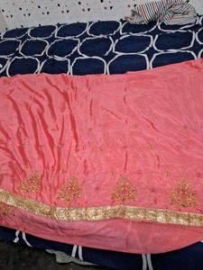 It Is Pink Color Georget With Golden Net Border .