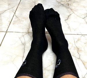 One Pair Of Worn Black Socks