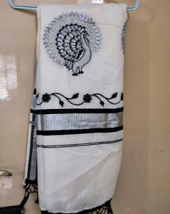 Kasuva Saree with black and silver bold border .