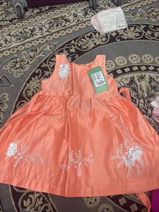 Cute Peach Dress with Floral Detail