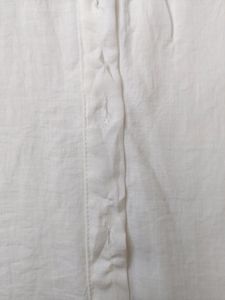 White shirt with red scallop detailing