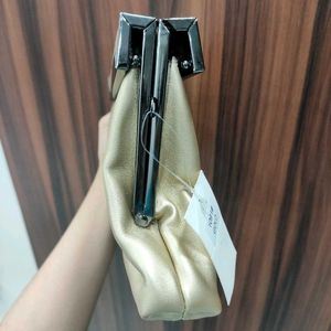 NWT Embelle Gold Cluth With Black Metal Sling