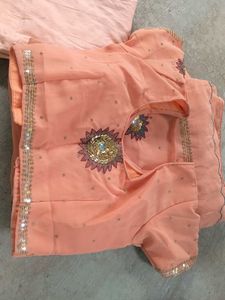 Peach colour saree with blouse and peticoat