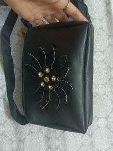 Stylish Black Sling Bag with Floral Cut Design
