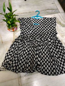 Flared Black Top With Teardrop Detail