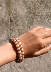 Elegant Pearl Bangle with Tassels