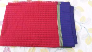 Red colour saree with multi coloured boarders,  fe