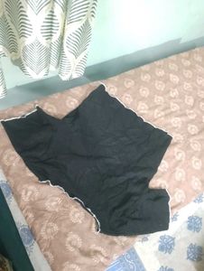 Black Top with White Stitch Detail