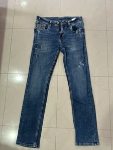 Distressed Denim Jeans