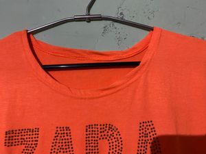 Soft Fabric,Cute Orange Bold Colour Top With Topography Print,medium In Size Bust Size -32, Can Pair It With Black Pant Or Dark Blue Jeans
