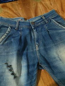 Ripped Blue Denim Jeans