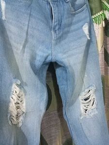 Mid Rise Ripped Denim Jeans